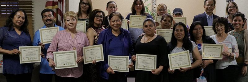 BHC members hold up completion certificates