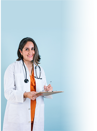LatinX woman doctor smiling with clipboard