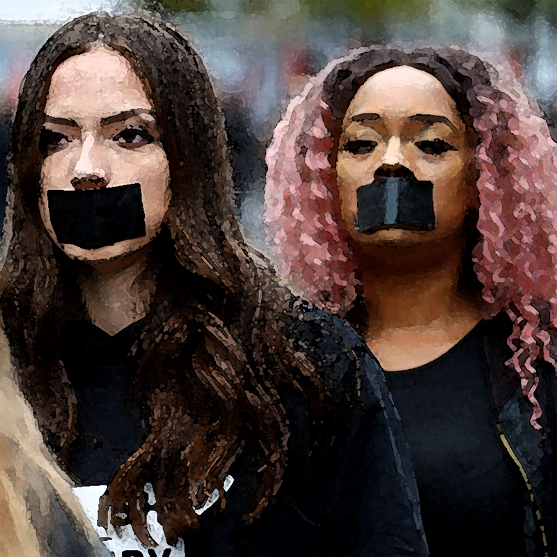 two young women with tape over their moths protesting the silencing of victims