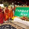 Cambodian monks pray next to new Long Beach Cambodia Town sign 