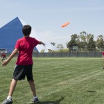 Two boys passing a frisbee