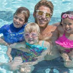 Counselor and his kids in the pool