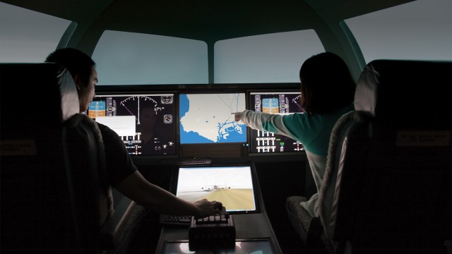 Photo of students in the Boeing Flight Simulator