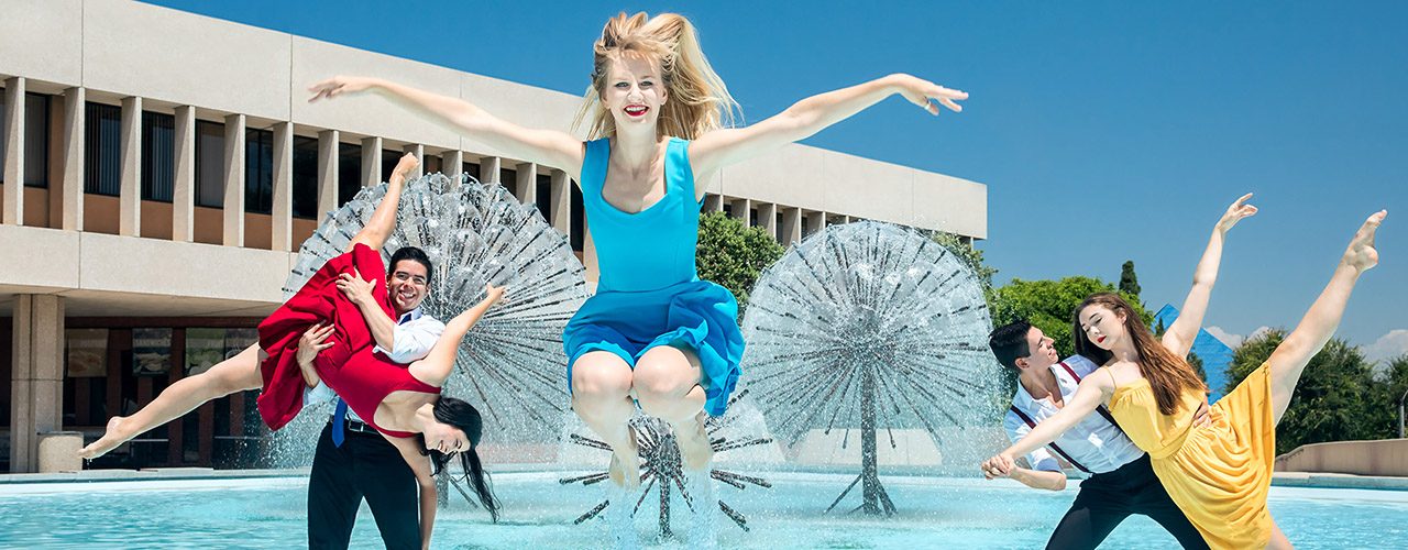 Dance students strike a pose in the Maxson Plaza fountain.