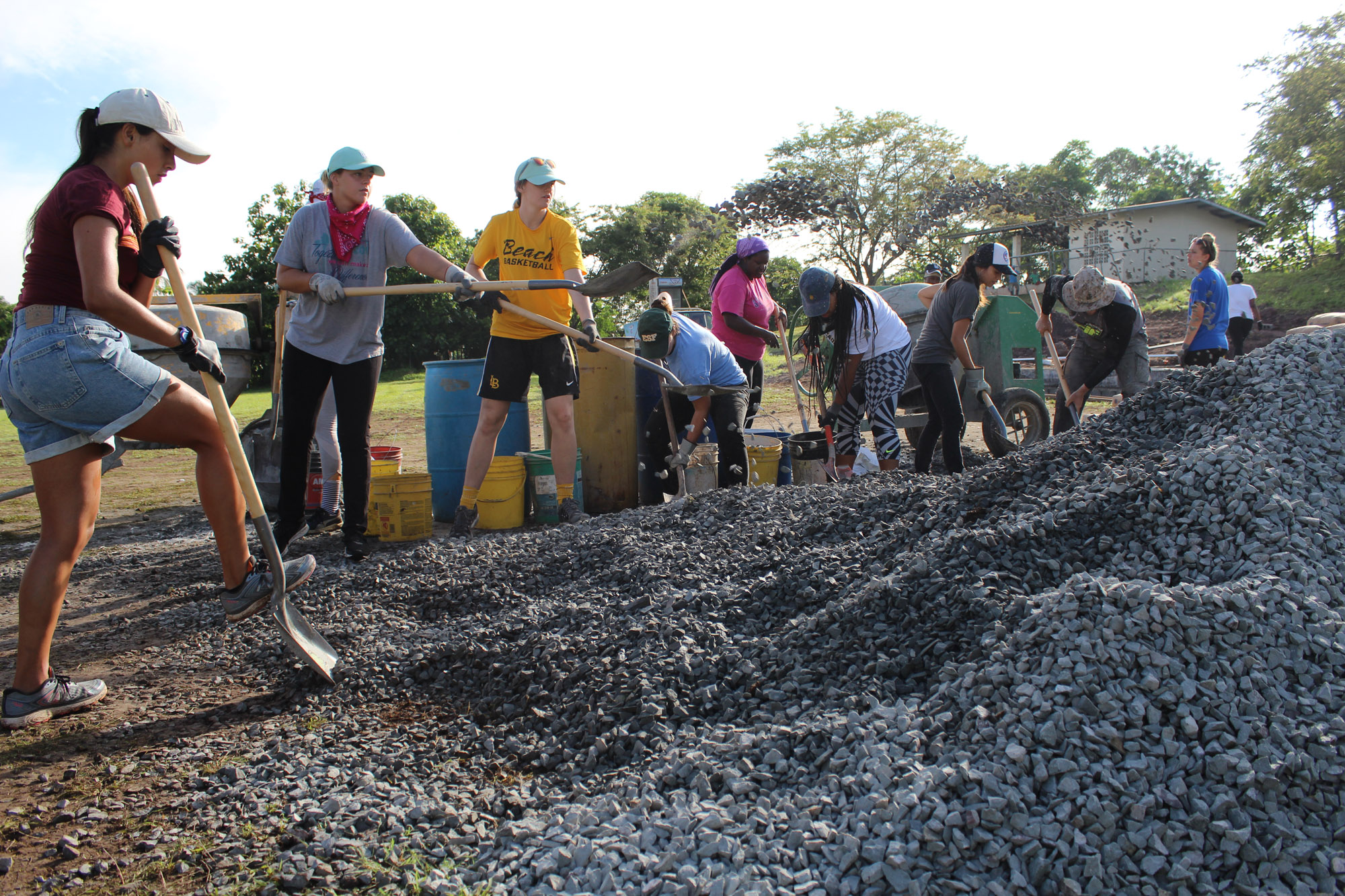 Group shoveling gravel