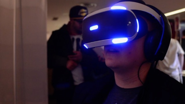 A student uses a VR headset at the BeachCon event.