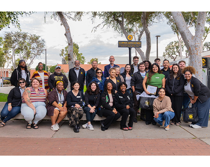Carmen Arredondo Empolyee of the Month sign on friendship Walk