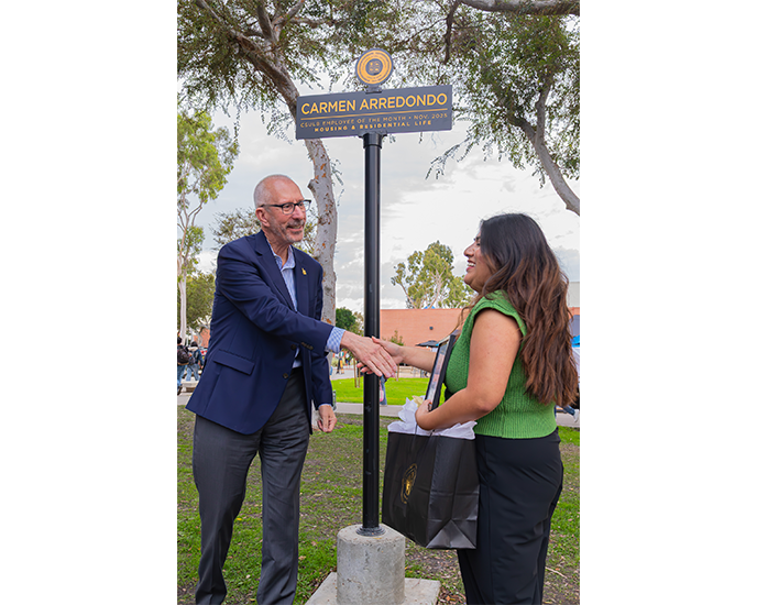 President Andrew Jones presentation of EOM Carmen Arredondo on friendship Walk